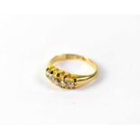 An 18ct gold five-stone diamond ring, the top comprising five graduated old cut diamonds, size I,