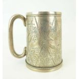 A Victorian hallmarked silver children's mug with Japanesque style decoration of bamboo, vines and