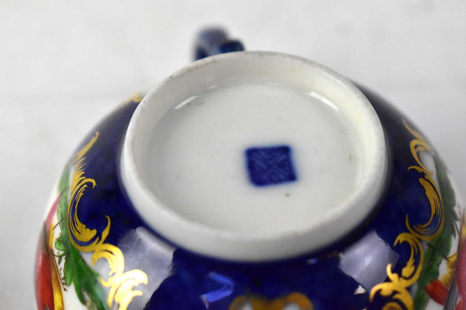 ROYAL WORCESTER; a circa 1760-65 cup and saucer, cobalt blue ground with vignettes of exotic - Image 3 of 3