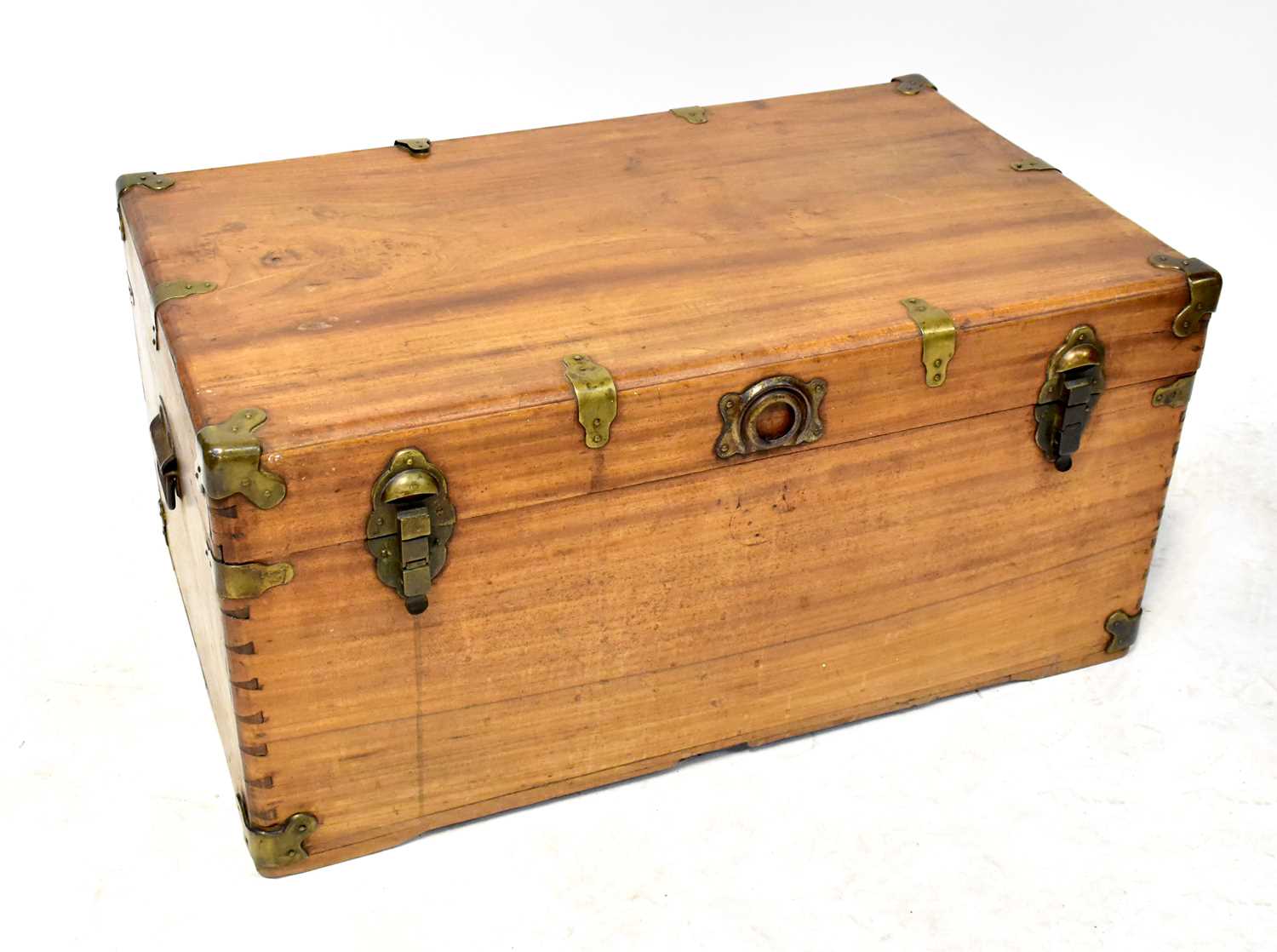 A vintage captain style pine travel trunk/chest with brass corners and straps and dovetail joints.43