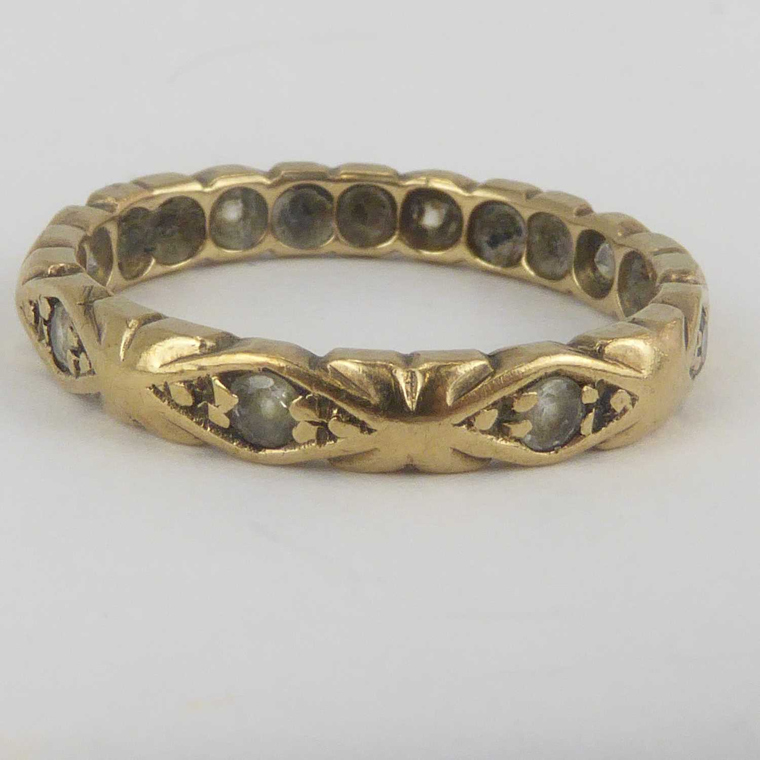 A 9ct white gold Celtic design ring, size Q and a yellow metal eternity ring set with tiny white - Image 3 of 3