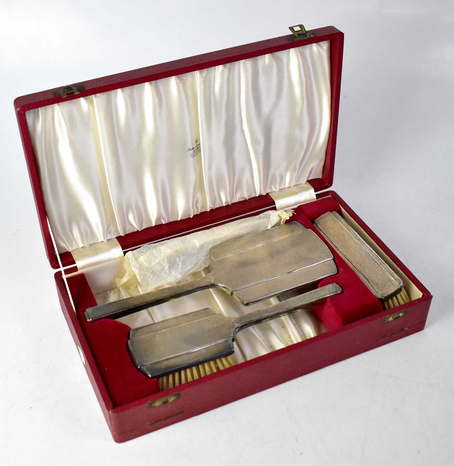 DEAKIN & FRANCIS LTD; an Elizabeth II hallmarked silver dressing table set, comprising hand