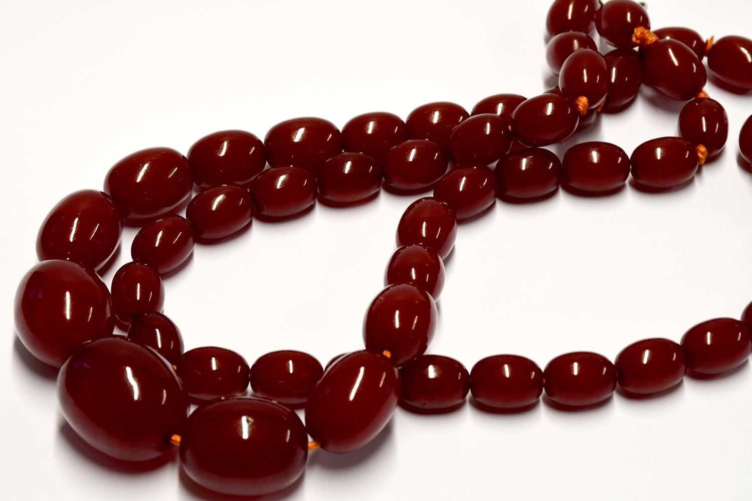 Two cherry amber-style necklaces, one with oval graduated beads, the other with circular beads. - Image 3 of 4