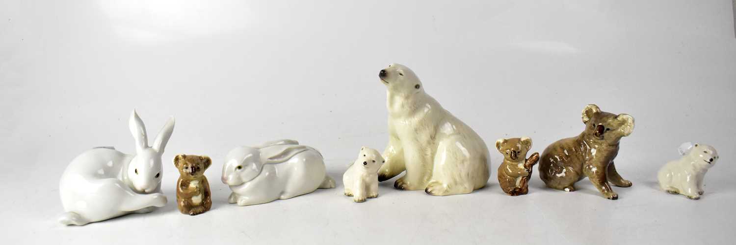 Various ceramics to include a Branksome polar bear group of mother and cubs, a pair of Lladro, a