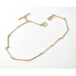 A 18ct yellow and white gold two-tone necklace with bar links joined with chain, small T-bar and