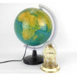 A modern illuminated globe, height approx. 38cm, diameter approx. 24cm, together with a small Schatz