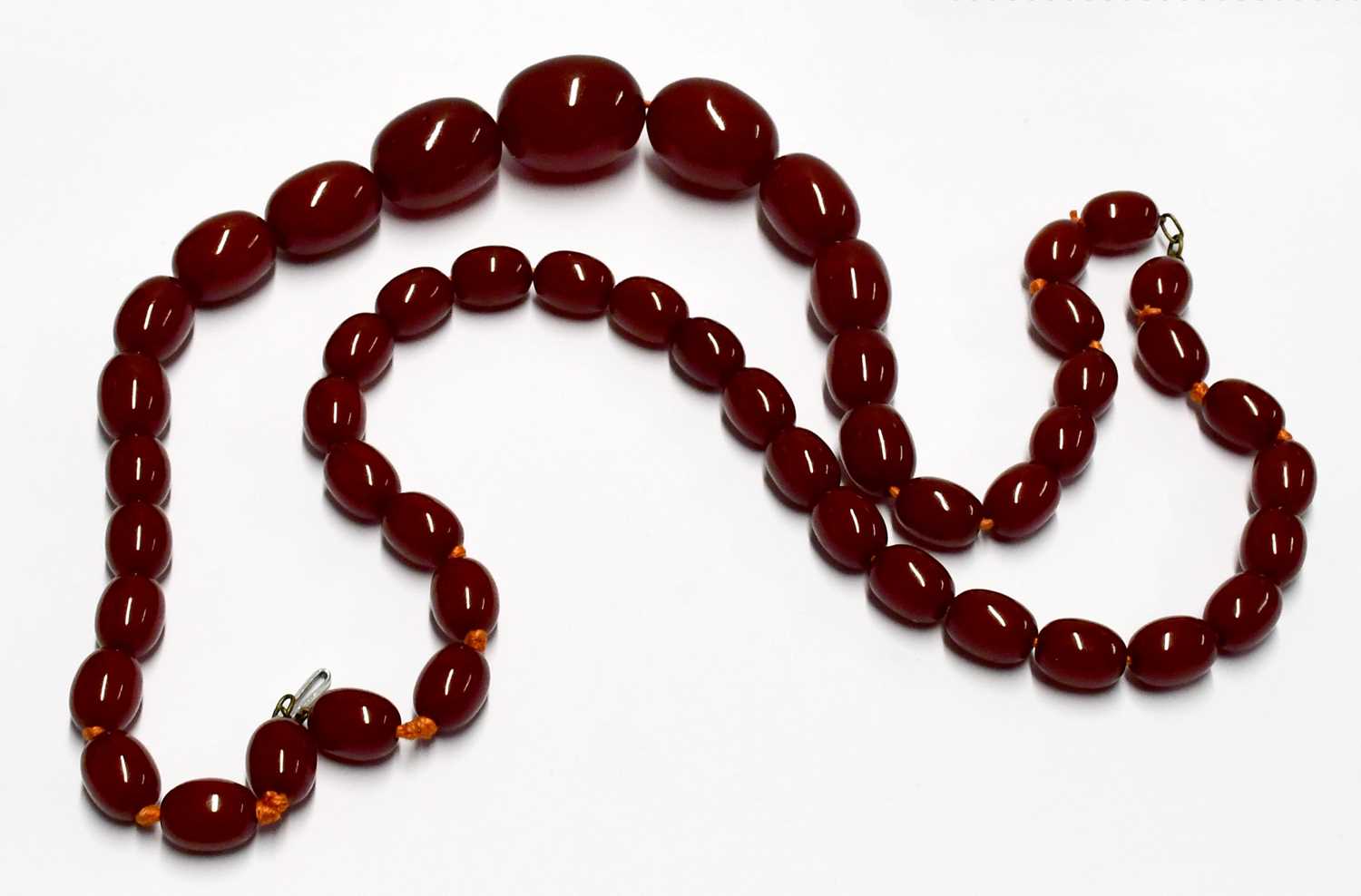 Two cherry amber-style necklaces, one with oval graduated beads, the other with circular beads. - Image 2 of 4