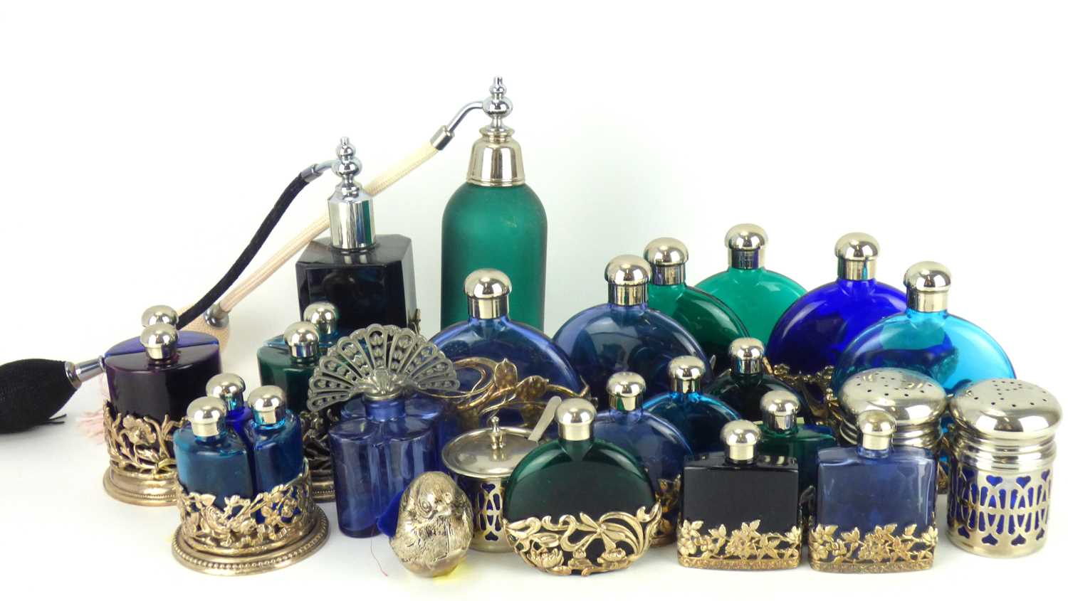 Approximately twenty-three modern coloured glass bottles, perfume decanters, etc, all in silver