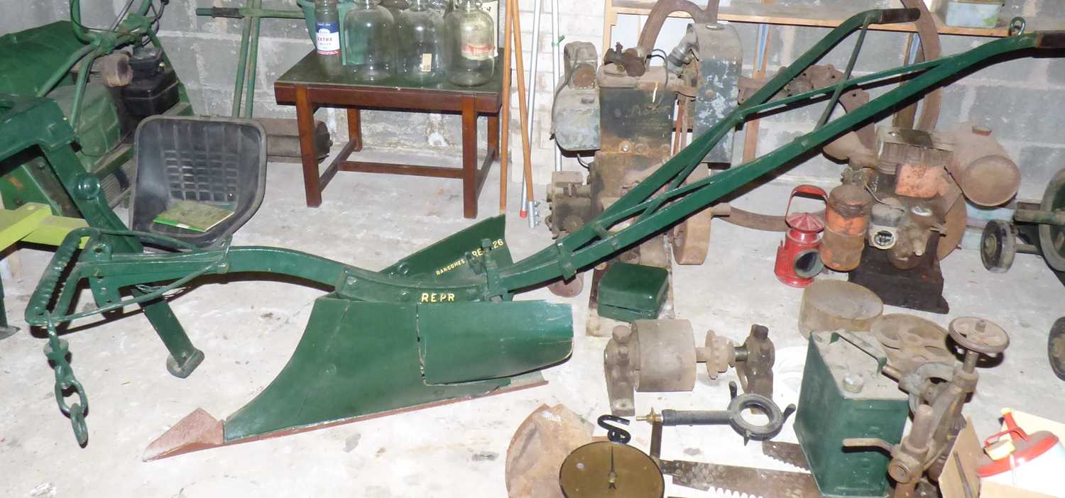 A vintage horse-drawn/machine pulled steel plough, marked Ransomes Repr 26, length 265cm. These