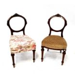 Four matching Victorian walnut balloon back dining chairs with overstuffed seats and reeded tapering