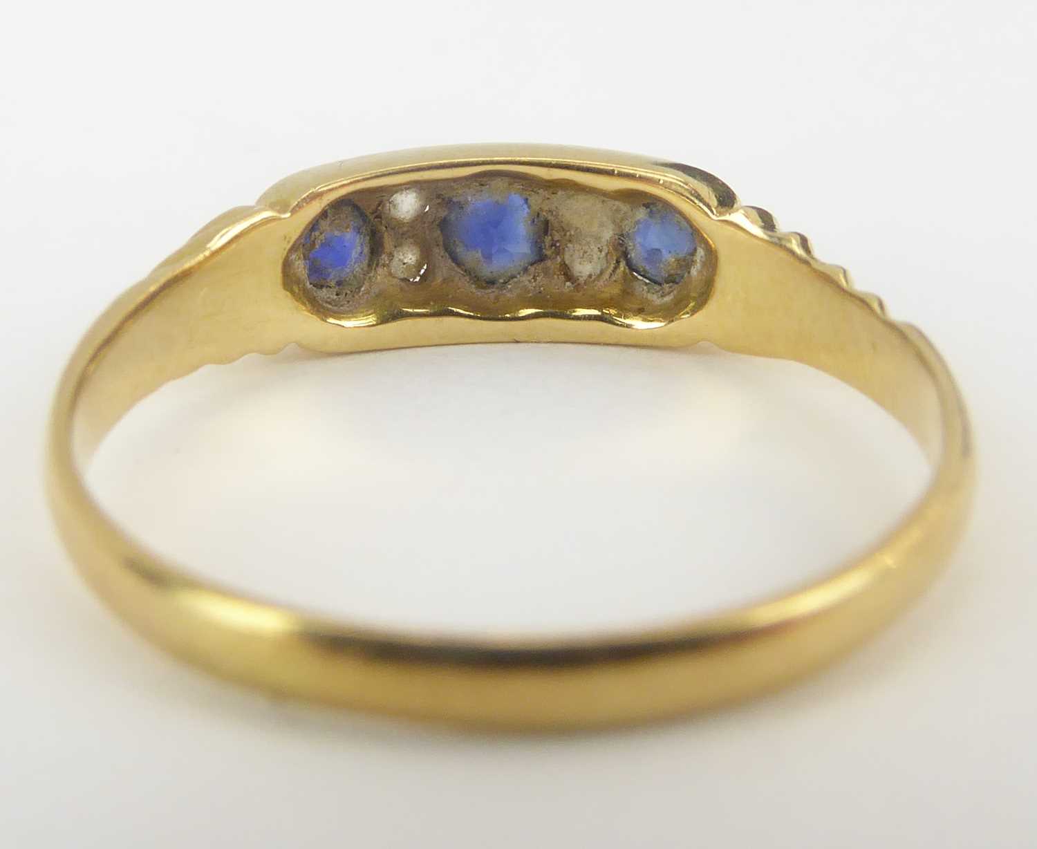Two 18ct gold dress rings comprising an example with three channel set sapphires separated with - Image 5 of 6