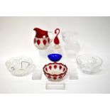 A group of cut glass to include two large bowls, a footed bowl, a large bowl and water jug with ruby