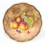 JOHN FREEMAN FOR ROYAL WORCESTER; a hand painted cabinet plate with scalloped edge, decorated with