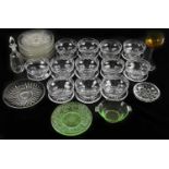 A small collection of glassware to include sundae bowls, green glass dishes, etc.