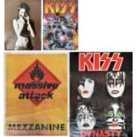 A collection of three music related posters, to include one Massive Attack and two Kiss examples,