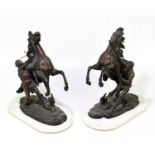 A pair of circa 1900 spelter Marly horses raised on white marble plinths, height approx 41.5cm.