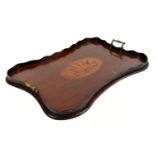 An Edwardian inlaid mahogany serpentine rectangular tray, with twin brass handles, length 58cm.