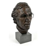 † IAN HANSON; a bronze bust of Neville Phillips, on square base, unsigned, height 38cm.Condition