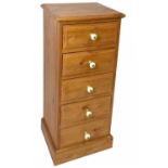 A modern pine chest of five drawers on plinth base, height 118cm, width 52cm, depth 44cm.