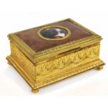 LIMOGES; a gilt metal leather set rectangular trinket box, the hinged lid centred with the