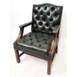 A reproduction mahogany framed green leather Gainsborough type chair, on block legs.