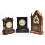 A late 19th century walnut and ebonised eight day mantel clock, with enamel Roman numeral dial and