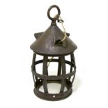 An Arts and Crafts copper lantern of barrel form, with studded detail, height 31cm, lacking glass.