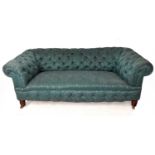 A Victorian two seater Chesterfield sofa upholstered in a button back floral material.Condition