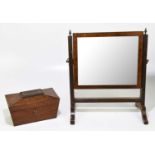 A mahogany tea caddy of sarcophagus form, together with a swing toilet mirror (2)