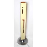 A contemporary Italian standard lamp, the painted rectangular shade with pierced stylised detailing,
