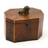 A 19th century mahogany tea caddy with satinwood crossbanded detail, the cover with applied finial