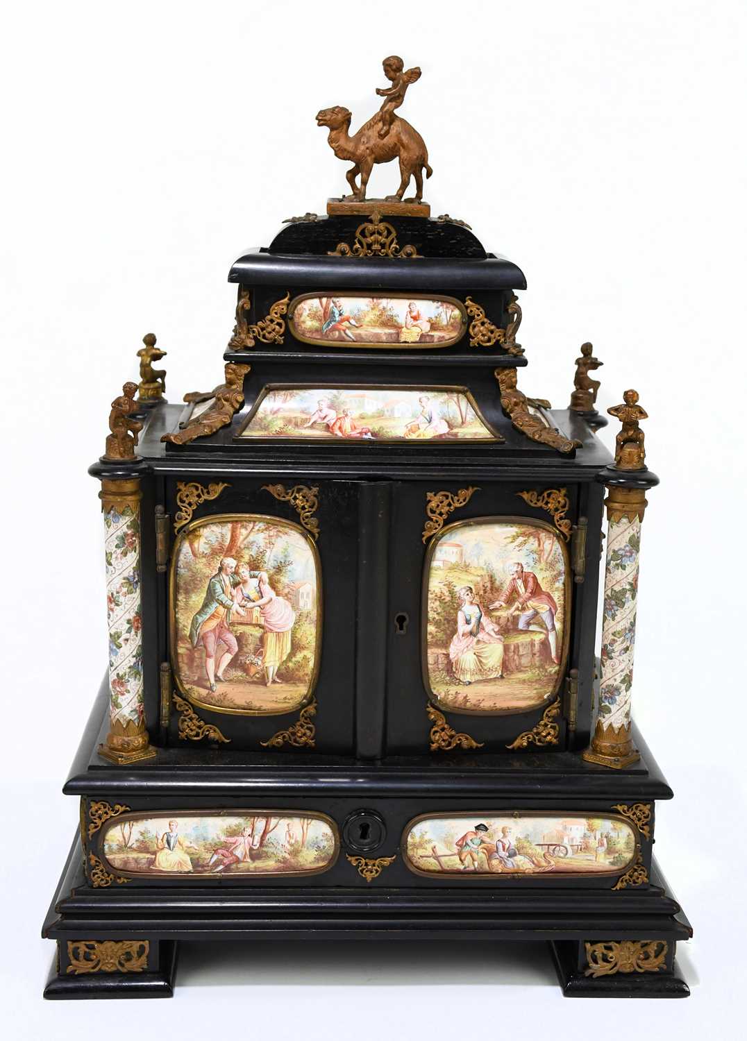 A fine quality 19th century ebonised wood table cabinet with Viennese enamel style panels, with gilt