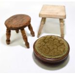 A small elm stool on turned column supports, together with a further stool and a circular foot stool