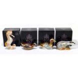 ROYAL CROWN DERBY; four animal form paperweights to include ‘Swirl Seahorse’, ‘Woodland Badger’, ‘