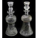 Two 19th century cut and etched glass thistle decanters with star cut bases, height 31cm.Condition