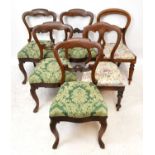 A set of four Victorian mahogany dining chairs, with carved open backs and upholstered seats on
