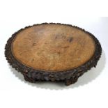 A 19th century carved oak Lazy Susan, the border and base carved with oak leaves and acorns,