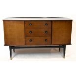 WRIGHTON; a mid-century teak sideboard, with three central drawers and three cupboard doors, on