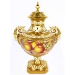 JOHN FREEMAN FOR ROYAL WORCESTER; a twin handled hand painted pedestal urn vase and cover, decorated