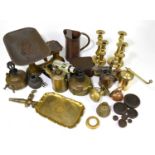 A collection of assorted metalware including a set of balance scales, brass candlesticks, oil lamps,