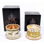 ROYAL CROWN DERBY; two money boxes comprising 'Carousel' from the Treaures of Childhood series