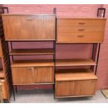 AVALON; a mid-century teak shelf and cupboard stacking unit comprising three drawer chest, two