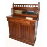 An Edwardian walnut chiffonier with raised mirror back above a single drawer and two panelled doors,