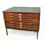 ABBESS; a teak six drawer plan chest on black painted metal supports, width 116cm, depth 90cm,