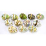 Twelve Bilston & Battersea and Halcyon Days trinket boxes in the form of eggs, various designs to