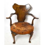 A late 19th / early 20th century walnut open arm elbow chair in the 18th century style, with