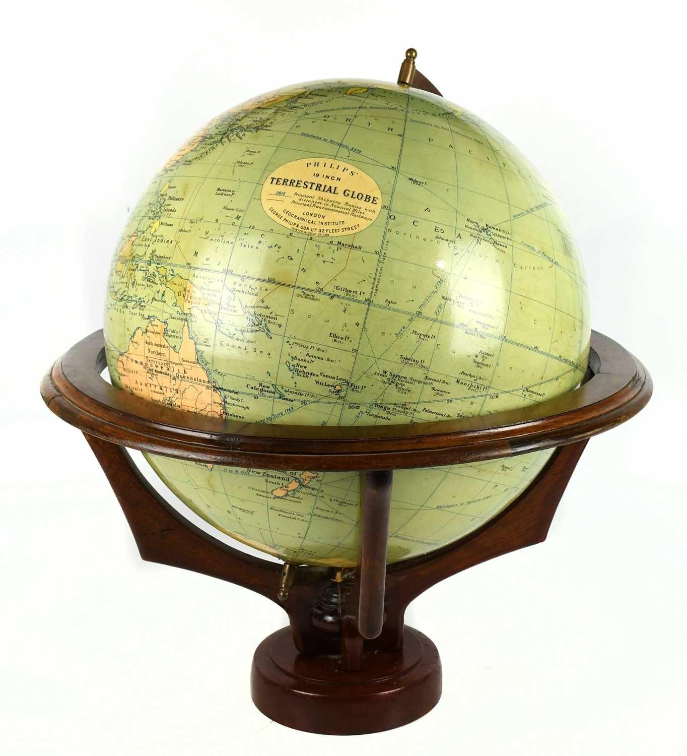 PHILLIPS; a 19” terrestrial globe on a wooden stand, height approx 64cm.