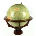 PHILLIPS; a 19” terrestrial globe on a wooden stand, height approx 64cm.