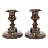 A pair of Cornish Serpentine candlesticks, height 14cm.Condition Report: One example with small chip