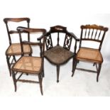 A pair of early 19th century faux rosewood caned seat chairs, on turned legs, with a later 19th